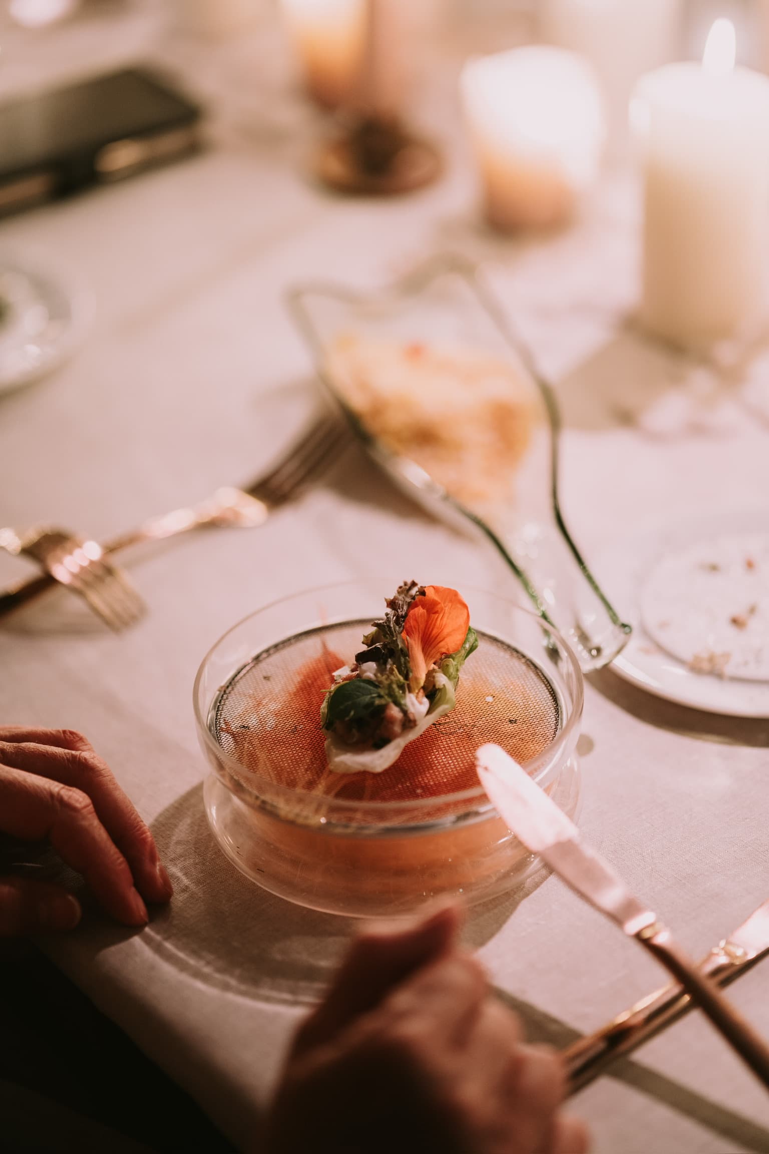 Gourmet dish with edible flowers by an eco-conscious caterer